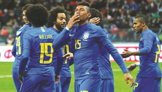 Brazilu2019s Paulinho (No 15) celebrates scoring a goal against Russia in their friendly match in Moscow yesterday. (Reuters)