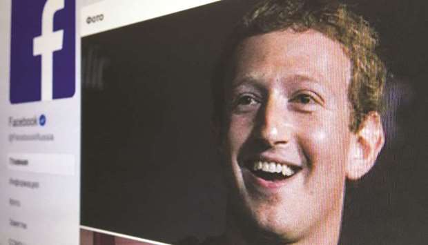 A picture taken in Moscow shows an illustration picture of theRussian language version of Facebook, about page feat uring the face of founder and chief executive Mark Zuckerberg.