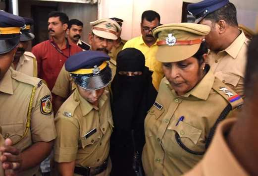 Police take away Yasmin Mohamed Zahid after a National Investigation Agency court sentenced her to seven years of imprisonment, in Kochi yesterday.
