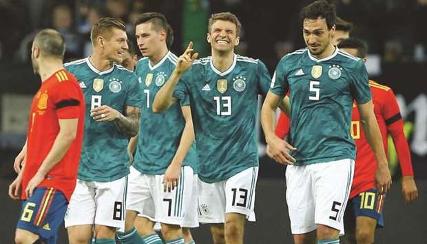 Germanyu2019s Thomas Mueller (second right) celebrates with teammates after scoring their first goal against Spain during their friendly match in Du00fcsseldorf on Friday. (Reuters)