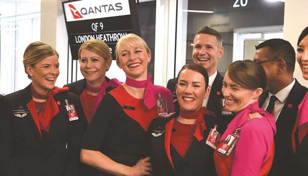 Cabin crew wait to board a Qantas 787 Dreamliner before taking off on its inaugural flight from Perth to London yesterday. Qantasu2019 14,498 kilometre journey from the southwestern city to London is the worldu2019s third-longest passenger flight, the carrier said, and the first ever regular service to connect the two continents directly.