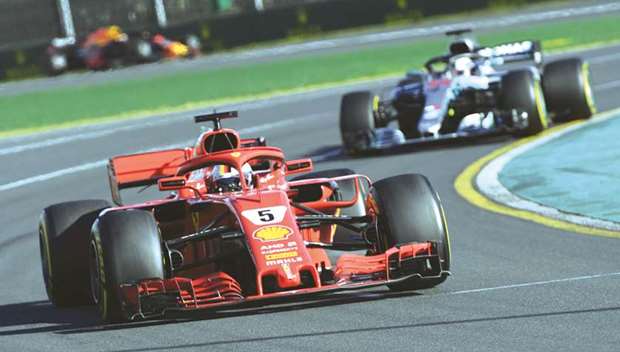 Ferrariu2019s Sebastian Vettel (front) leads Mercedesu2019 Lewis Hamilton during the Formula One Australian Grand Prix in Melbourne yesterday. (AFP)