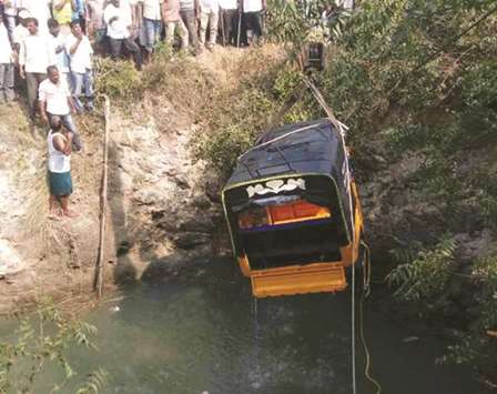Rescue workers pull out an auto-rickshaw that fell into a well in Telanganau2019s Nizamabad district yesterday. At least 10 people were killed when the overcrowded auto-rickshaw fell into the road side open well.