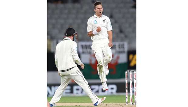 New Zealandu2019s fast bowler Trent Boult celebrates after taking the wicket of Englandu2019s Joe Root in Auckland yesterday. (AFP)