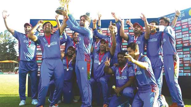 Afghanistan team celebrate after winning the ICC Cricket World Cup Qualifier at the Harare Sports Club yesterday. (ICC)