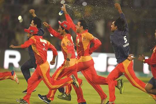 Islamabad United players celebrate after their win over Peshawar Zalmi in the Pakistan Super League final in Karachi. (AFP)