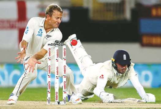 Englandu2019s Stuart Broad dives to make his ground as New Zealandu2019s Neil Wagner tries to field the ball during the fifth day of the first Test in Auckland. (Reuters)