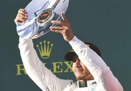 Second-placed Mercedesu2019 British driver Lewis Hamilton celebrates on the podium in Melbourne on Sunday.