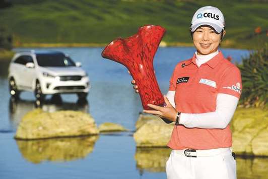 Eun-Hee Ji of Korea celebrates with the winneru2019s trophy in Carlsbad, California.