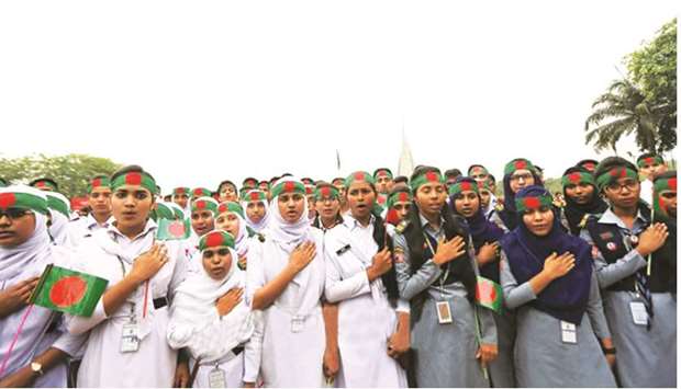 Schoolgirls paying their respects to martyrs at the National Memorial in Savar, near Dhaka, yesterday.
