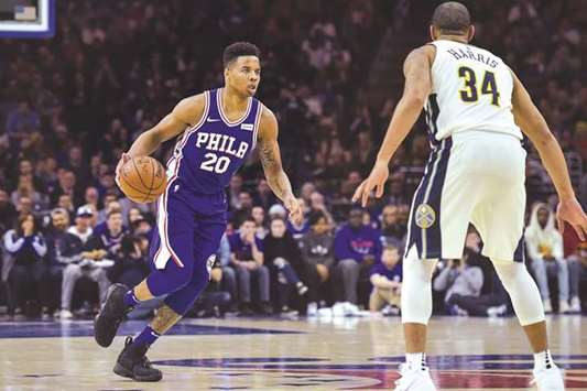Philadelphia 76ers guard Markelle Fultz (left) dribbles the ball as Denver Nuggets guard Devin Harris defends during the first quarter of their NBA game at the Wells Fargo Center. PICTURE: USA TODAY Sports