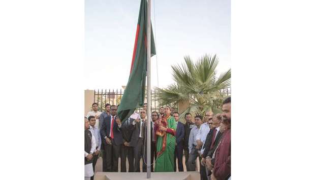 Dr Dipu Moni and Ashud Ahmed jointly hoisting the national flag of Bangladesh on the occasion of the Independence and National Day yesterday.