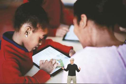 Apple CEO Tim Cook introduces Appleu2019s new iPad during an event at Lane Tech College Prep High School in Chicago.