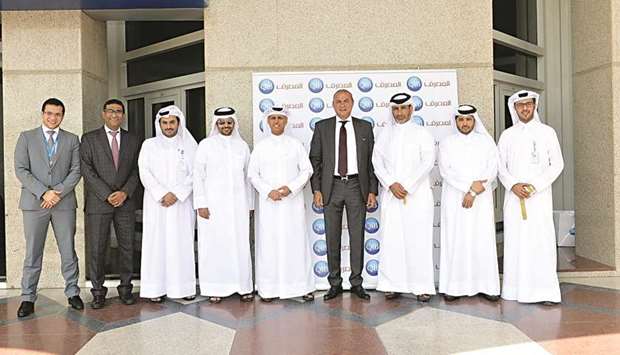 QIB executives and staff at the blood donation drive.