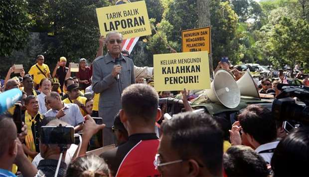 Malaysia's opposition coalition prime ministerial candidate Mahathir Mohamad speaks against a controversial proposal to redraw electoral boundaries outside near the Parliament House in Kuala Lumpur