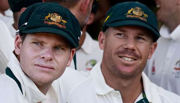Steve Smith (L) captain of Australia and teammate David Warner (R)