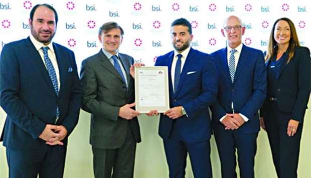 Al-Meer (third right) receives the award from Foschi in London recently.
