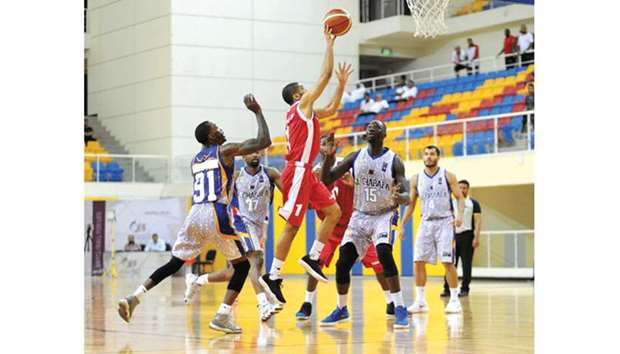 Al Shamal and Al Gharafa players in action during the Emiru2019s Cup basketball tournament yesterday.