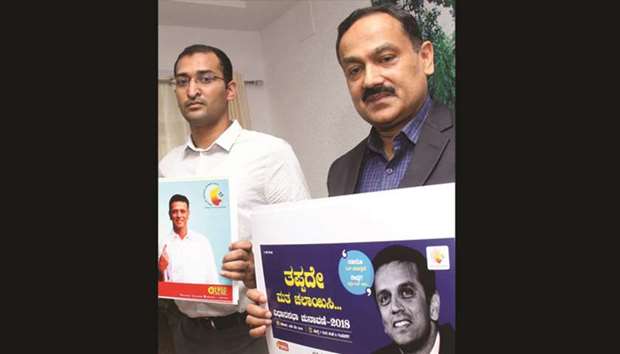 Karnatakau2019s Chief Electoral Officer Sanjiv Kumar launches election posters featuring former cricketer Rahul Dravid, who has been appointed as the state election icon, in Bengaluru yesterday.