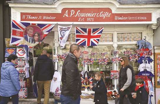 Memorabilia celebrating the engagement of Prince Harry to fiancee US actress Meghan Markle are for sale in a gift shop in Windsor, west of London. Harry and Meghan Markle will marry on May 19 at St Georgeu2019s Chapel in Windsor Castle.