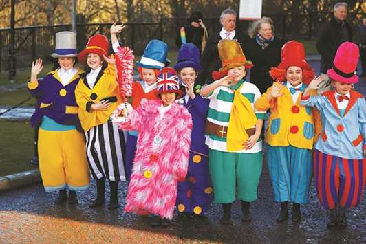 Children wearing u201cDiddy Menu201d costumes, a character popularised by Ken Dodd, line up after the comedianu2019s funeral at Liverpool Cathedral, in Liverpool, Britain, yesterday.