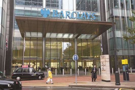 A London taxi cab is seen in front of the Barclays headquarters in the Canary Wharf business, financial and shopping district of London. The bank denied misleading investors about the quality of the mortgage loans backing the instruments and allegations it committed mail fraud and bank fraud.