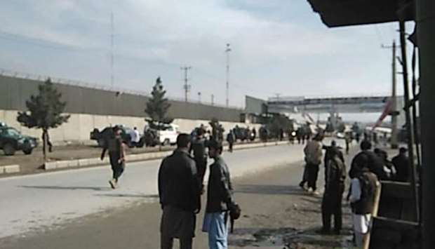People gather at the scene of attack after the blast