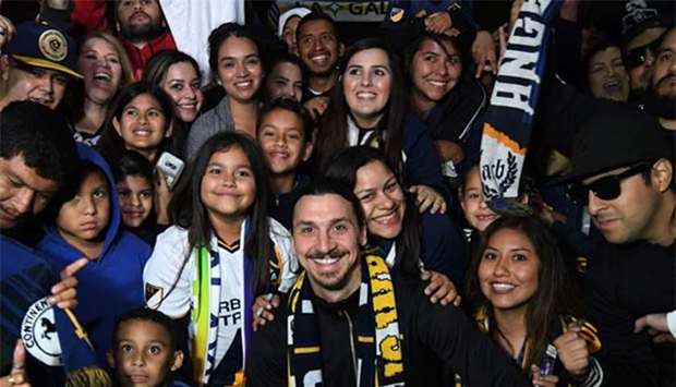 Zlatan Ibrahimovic is greeted by fans after arriving at Los Angeles International Airport to begin his new contract with LA Galaxy in Los Angeles.