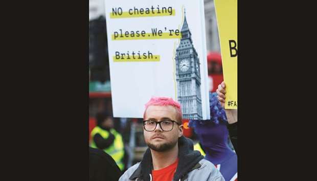 Whistleblower Christopher Wylie attends a protest against data analysis company Cambridge Analytica in London. Wylie, a former research director at Cambridge Analytica, had earlier claimed a so-called data grab had been carried out on more than 50mn profiles in 2014.