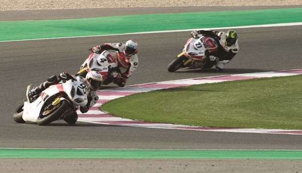 Qataru2019s Mishal al-Naimi leads the pack during the Superpole for the fourth round of the Qatar Superstock 600 yesterday at Losail International Circuit.