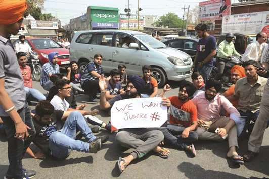 Students shout slogans during a protest against Human Resource Development Minister Prakash Javadekar in Amritsar yesterday against the decision to hold re-exams in economics and mathematics.