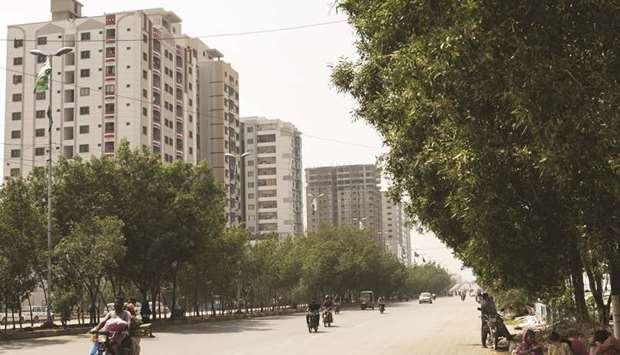 Newly constructed apartment buildings stand in Karachi. Estimates of Pakistanu2019s annual demand for housing units range between 400,000 and 700,000 with only about 100,000 to 350,000 formal units being built annually.