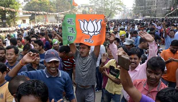 Indian supporters of the Bharatiya Janata Party (BJP) state a rally in Tripura
