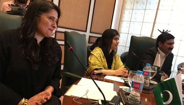 Pakistani activist and Nobel Peace Prize laureate Malala Yousafzai (C) attends a meeting with Pakistani womenu2019s rights activists alongside Oscar-winning director Sharmeen Obaid-Chinoy (L) in Islamabad
