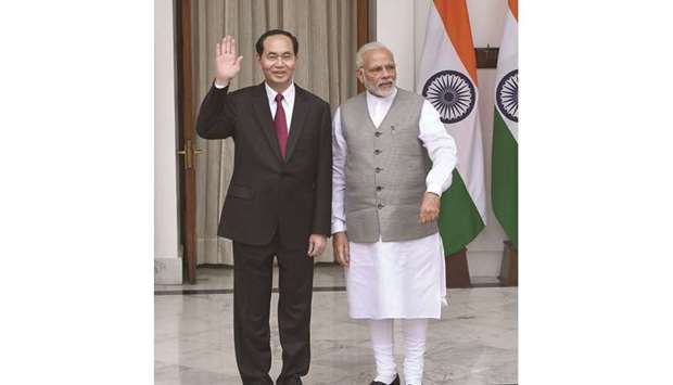 Vietnamu2019s President Tran Dai Quang gestures as he stands with Prime Minister Narendra Modi prior to a meeting and agreement signing in New Delhi yesterday.