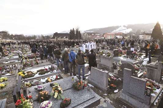 Relatives and friends attend the funeral of investigative reporter Kuciak at the cemetery in Stiavnik.