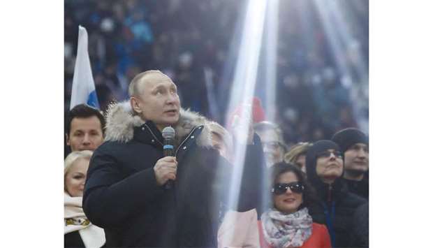 Putin delivering his speech during the rally at Luzhniki Stadium.