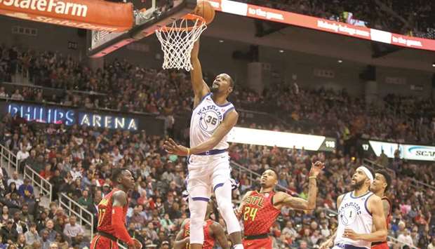 Golden State Warriors forward Kevin Durant (35) dunks against the Atlanta Hawks in the first quarter of their NBA game on Friday. PICTURE: Brett Davis-USA TODAY Sports