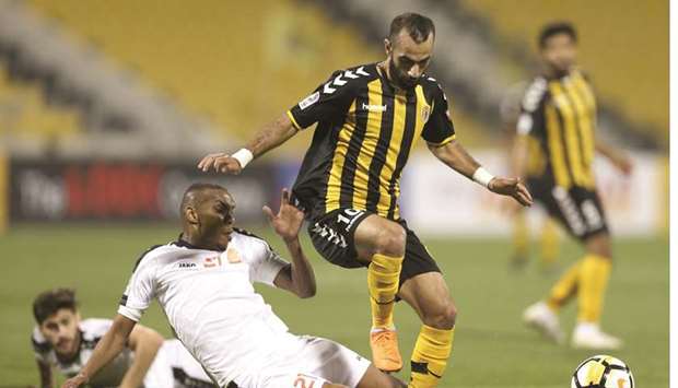 Qatar SCu2019s Osama Omari (right) in action during the QNB Stars League match against Umm Salal yesterday. PICTURE: Anas Khalid