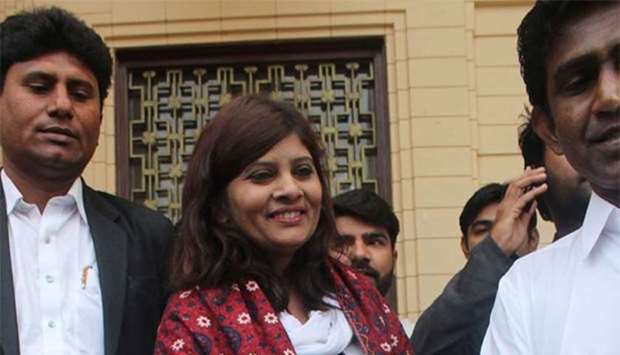 Pakistani opposition candidate Krishna Kumari Kohli is walking out from Sindh province assembly after the Senate election in Karachi.