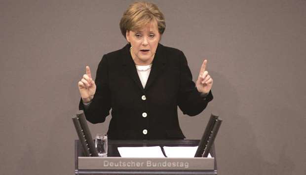 This file photo taken on November 30, 2005 shows Angela Merkel of the Christian Democratic Union (CDU) giving her first speech to parliament as German Chancellor at the Bundestag (lower house of parliament) in Berlin. Long dubbed the u201cQueen of Europeu201d, Germanyu2019s veteran Chancellor Angela Merkel emerges as the bruised survivor of her deepest crisis to govern for what many expect will be her final term. After 12 years at the helm of Europeu2019s top economy, the pastoru2019s daughter often called the worldu2019s most powerful woman goes on to live another day after post-war Germanyu2019s longest stretch of coalition haggling.