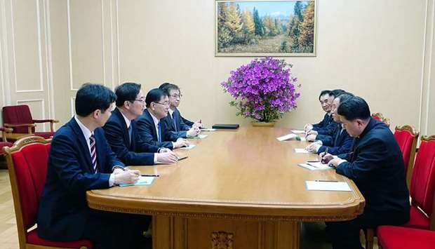 South Korean delegation (L row), who travelled as envoys of the South's President Moon Jae-in, talking with General Kim Yong Chol (2nd R), who is in charge of inter-Korean affairs for North Korea's ruling Workers' Party, during their meeting in Pyongyang.