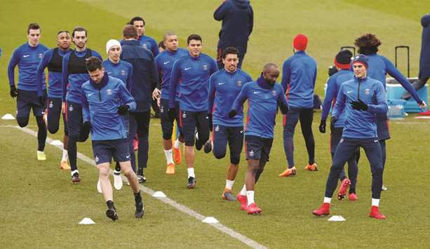 Paris St Germain players train ahead of their Champions League last 16 second leg match against Real Madrid in Saint-Germain-en-Laye, France, yesterday. (Reuters)
