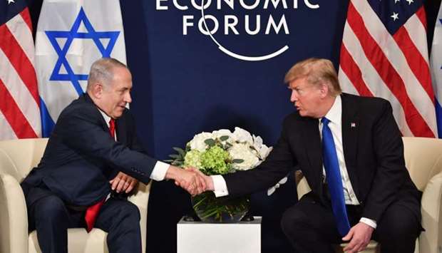 US President Donald Trump (R) shake hands with Israel's Prime Minister Benjamin Netanyahu during a bilateral meeting on the sidelines of the World Economic Forum (WEF) annual meeting in Davos, eastern Switzerland. File photo taken on January 25, 2018