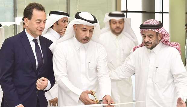 HE the Minister of Administrative Development, Labour and Social Affairs Dr Issa Saad al-Jafali al-Nuaimi and other dignitaries at the ribbon-cutting ceremony.