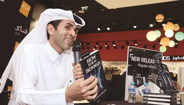 Dr Nasser Saqer al-Mohannadi shows his first book about his life as an athlete at the event. PICTURE: Jayan Orma