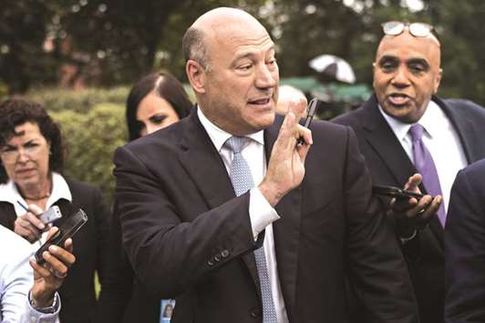 White House economic adviser Gary Cohn speaks to members of the media after a Bloomberg Television interview outside the White House in Washington, DC. Cohn is summoning executives from US companies that depend on the metals to meet this week with Trump to try to persuade him to blunt or halt the tariffs announced last week, say sources.