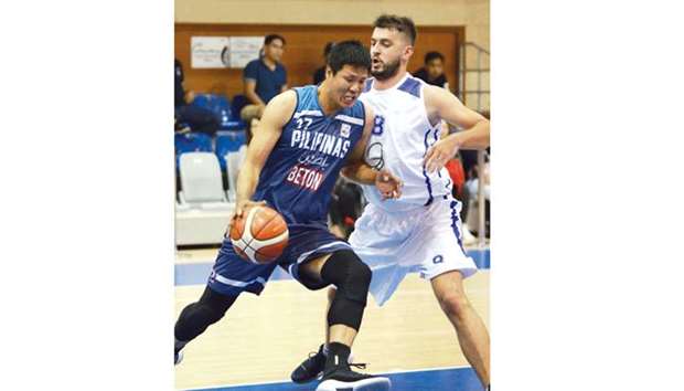 Rodel Mallari (left) of Pilipinas Beton in action during the Inter Nations Division match against Qavana Balkan in the Ooredoo Basketball Cup PIBAQ 25th Conference. PICTURE: Ronnie Castro
