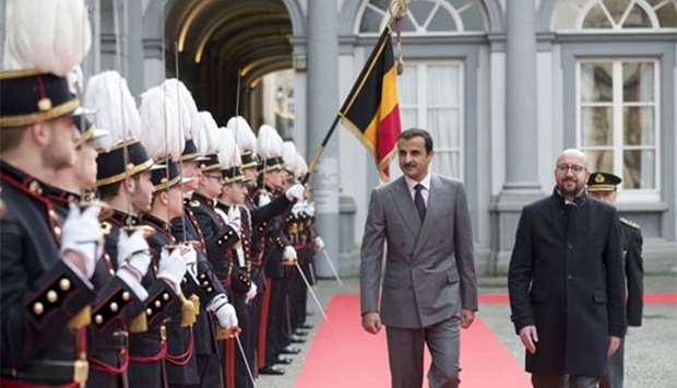 His Highness the Emir Sheikh Tamim bin Hamad al-Thani, seen with Belgian Prime Minister Charles Michel, inspects a guard of honour in Brussels on Tuesday.