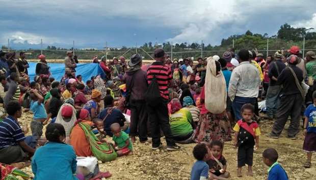People displaced by a March 1 earthquake gather at a relief centre in the central highlands of Papua New Guinea